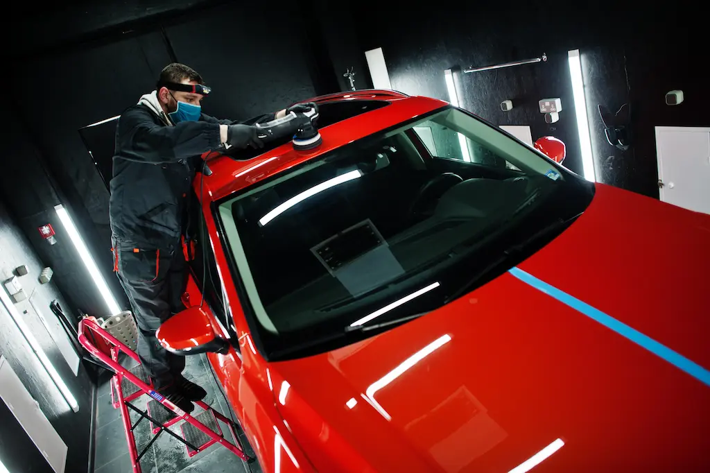 Technician applying paint protection film